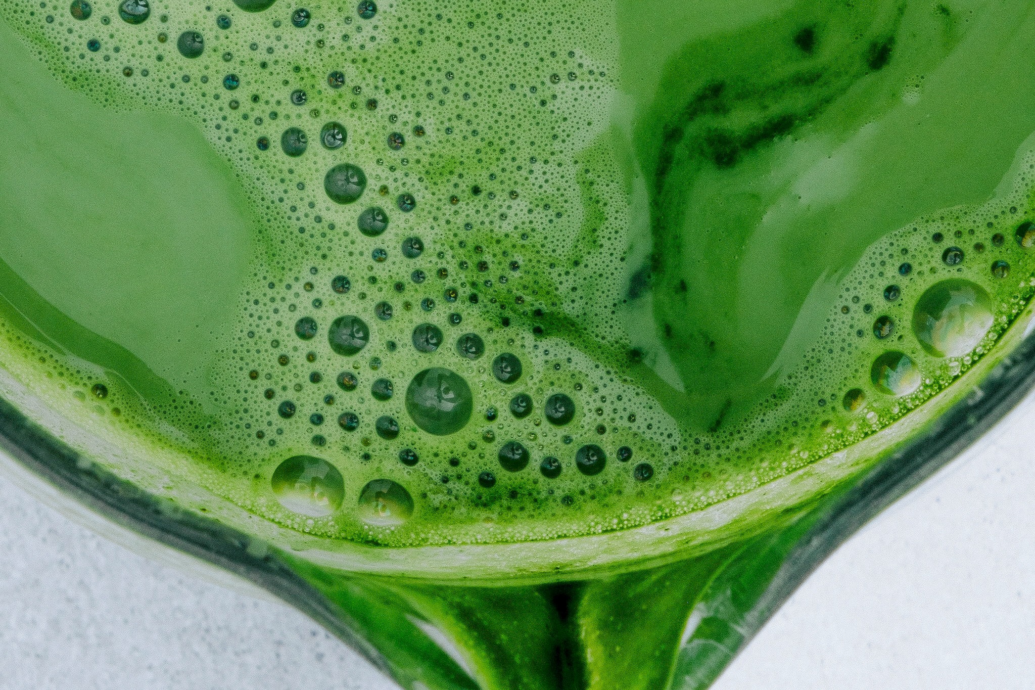 Close-up of freshly whisked green matcha